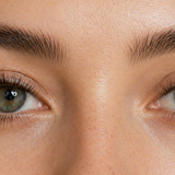 Model with lash extensions looking into the camera