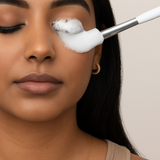 Girl washing her lashes with Lash Bath Foam and cleansing brush