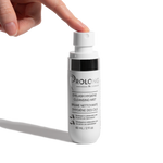 A hand presses the pump of a white bottle labeled Prolong Dr Janice Luk Eyelash Hygiene Cleansing Mist against a clean white background.